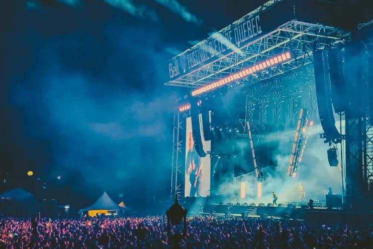 A packed, high‑energy event with branded sponsor activations and a main stage session