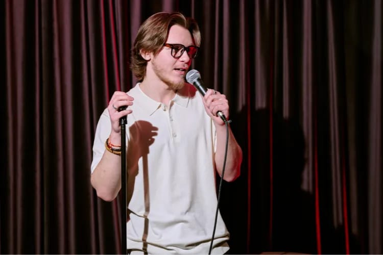 A shot of a comedian performing in a bar
