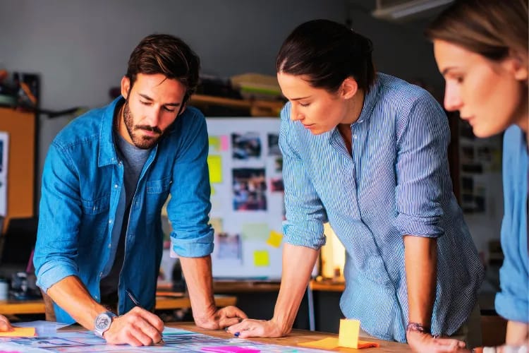 Event planner meeting with her team to discuss their next event plan