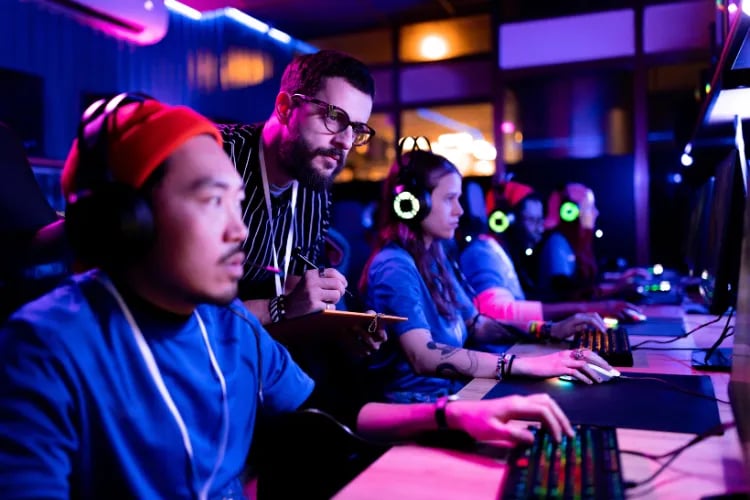 People playing in a gaming fundraising tournament