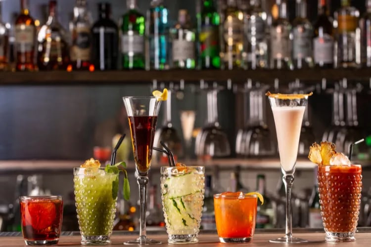 A shot of non-alcoholic cocktails standing on a bar table top