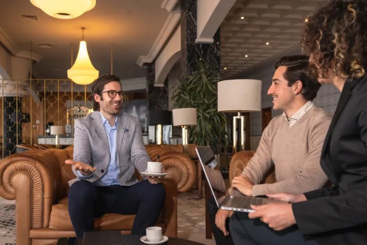 An Event Organizer negotiating with two managers of a venue