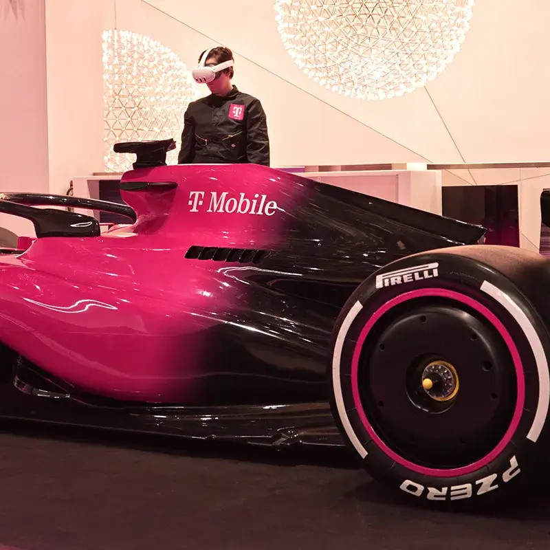 A Shot of The Las Vegas Grand Prix Activation - VR Glasses Next To The Formula 1 Car