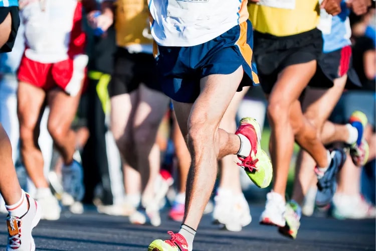 Shot of a big group of people running in a charity marathon event