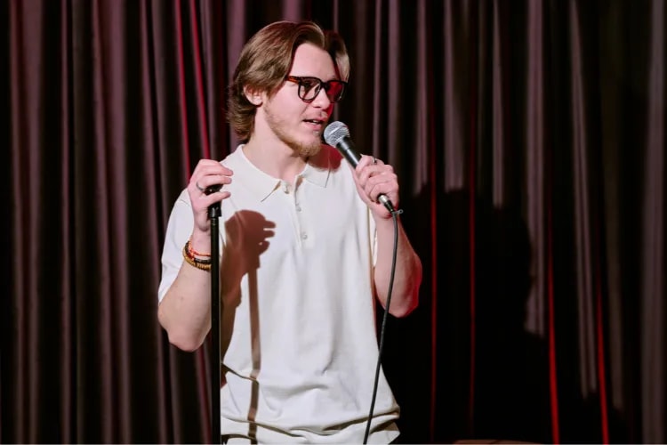 A shot of a comedian performing in a bar